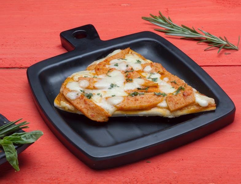 Tristan pizza with red sauce and mozzarella